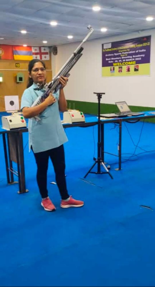 Dr. Kaushal on the range with a competition air rifle