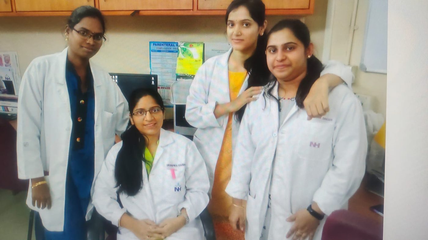 Dr. Kaushal with her nursing students in white coats